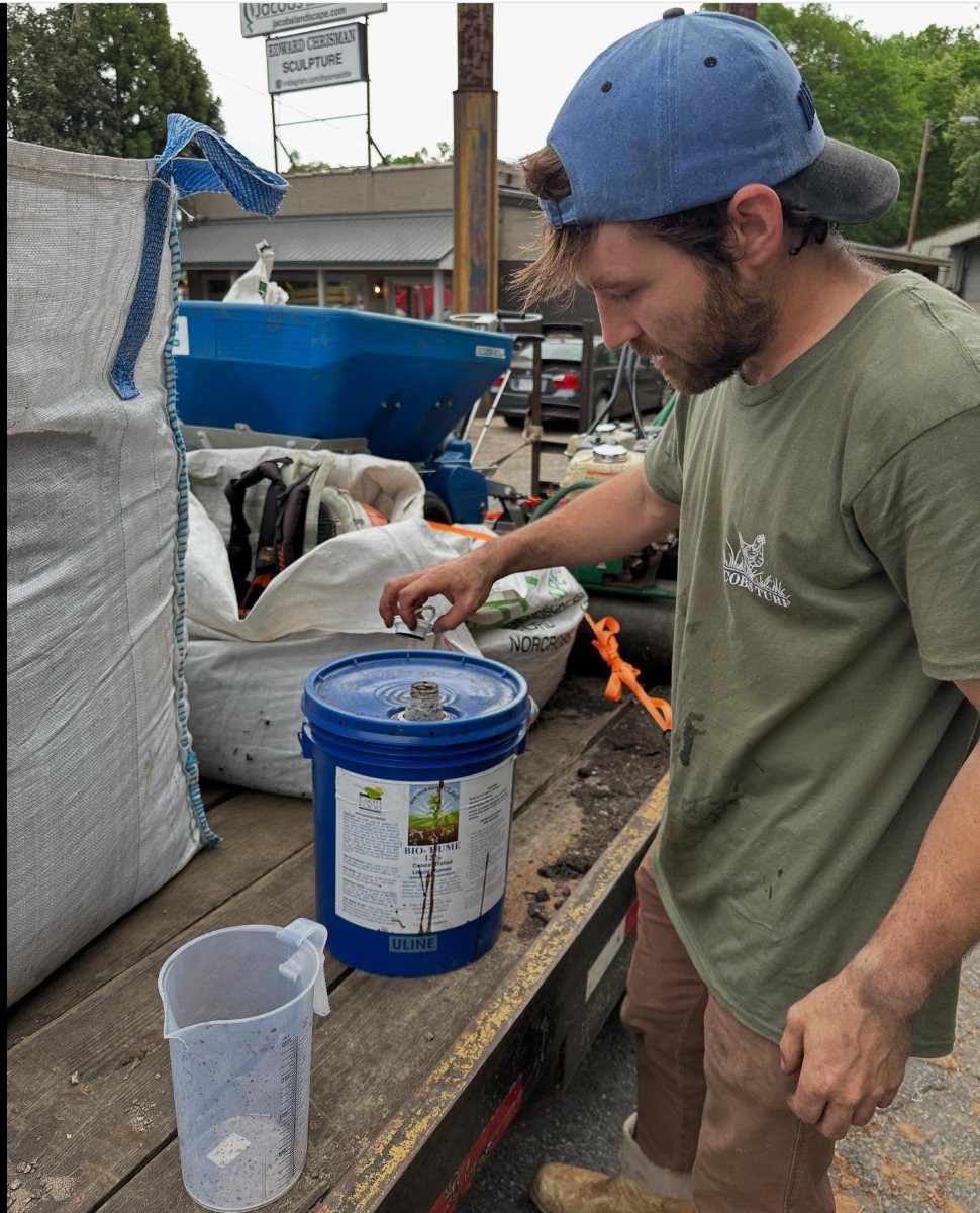 Will Jacobs, founder of Jacobs Turf, working on an Atlanta lawn